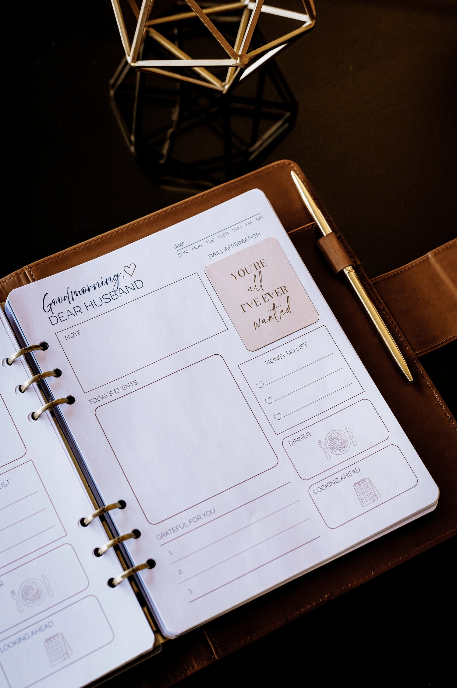 Honor Him Christian marriage planner displayed open inside a premium cognac vegan leather padfolio with a daily affirmation page designed to strengthen communication, gratitude, and intentional marriage.