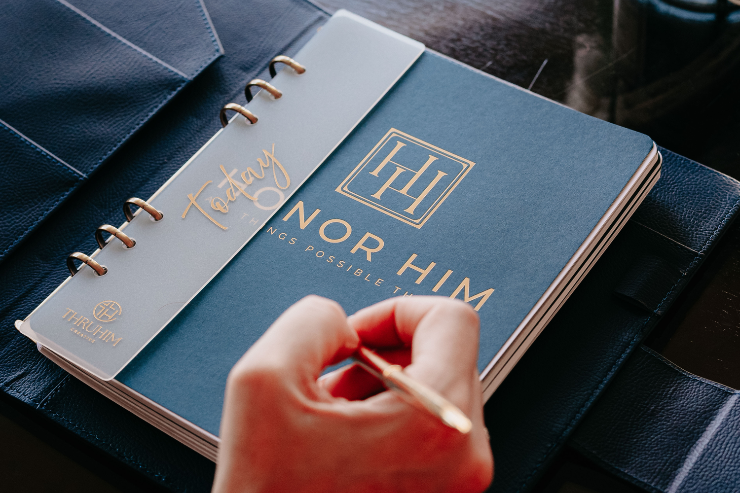Inside first page of Honor Him Luxe Marriage Transformation System Navy Edition on a table