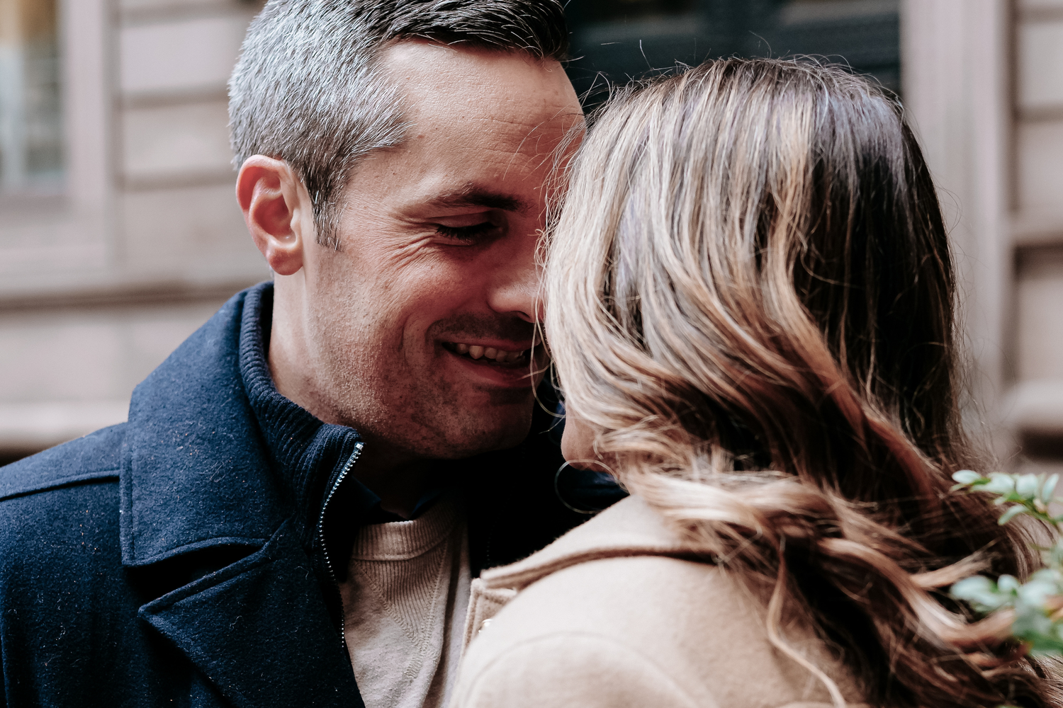 Husband and wife sharing a close moment outdoors