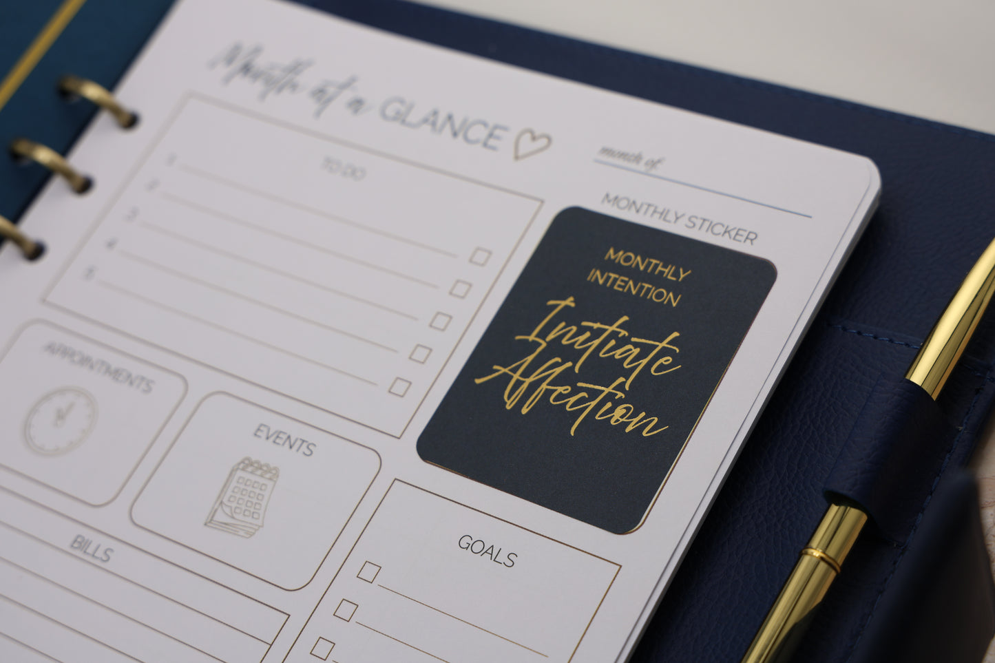 Honor Him Luxe Marriage Transformation System Navy Edition opened to a month-at-a-glance planner page