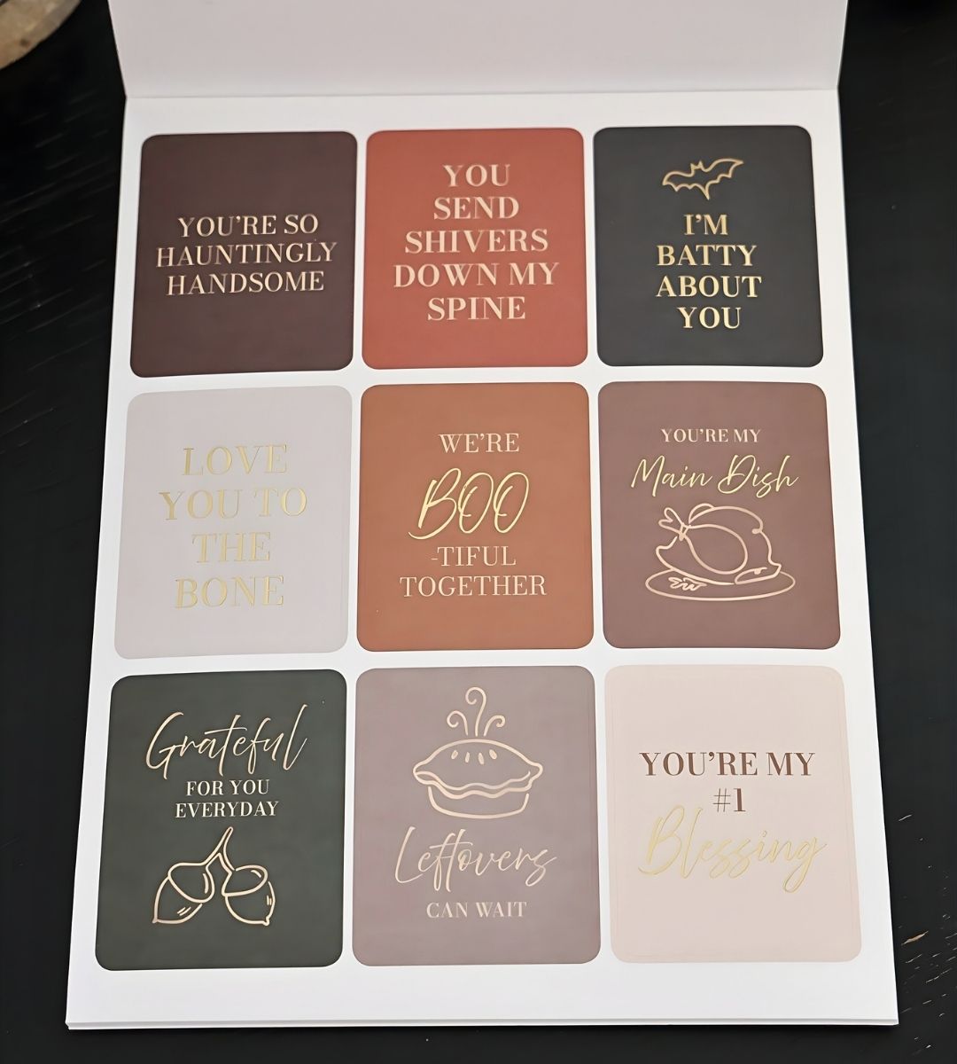Halloween and Thanksgiving affirmation stickers from the Honor Him Thru Holidays Affirmation Sticker Book with playful seasonal messages for marriage planners.