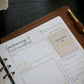 Honor Him Thru Words Affirmation Sticker Book displayed inside the Honor Him marriage planner with affirmation stickers.