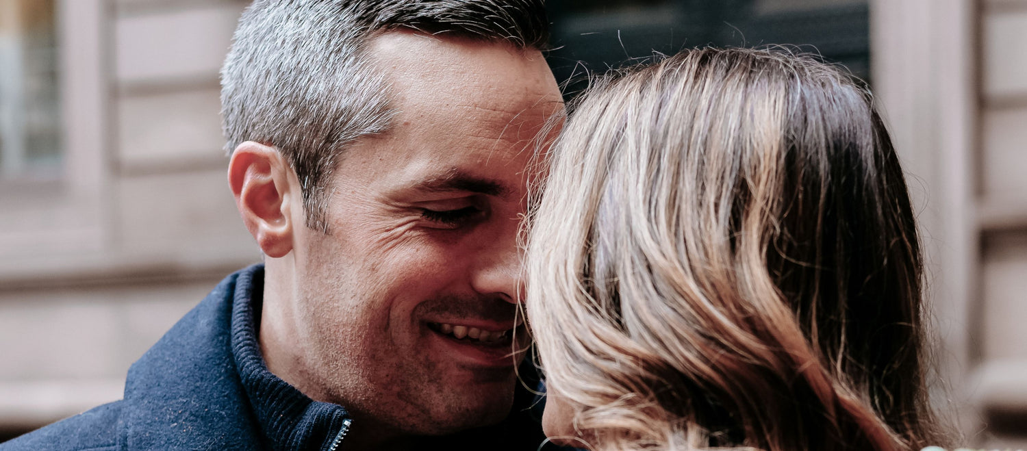Husband and wife sharing a joyful moment together, representing intentional love, emotional connection, and a Christ-centered marriage through the Honor Him Marriage Transformation System.